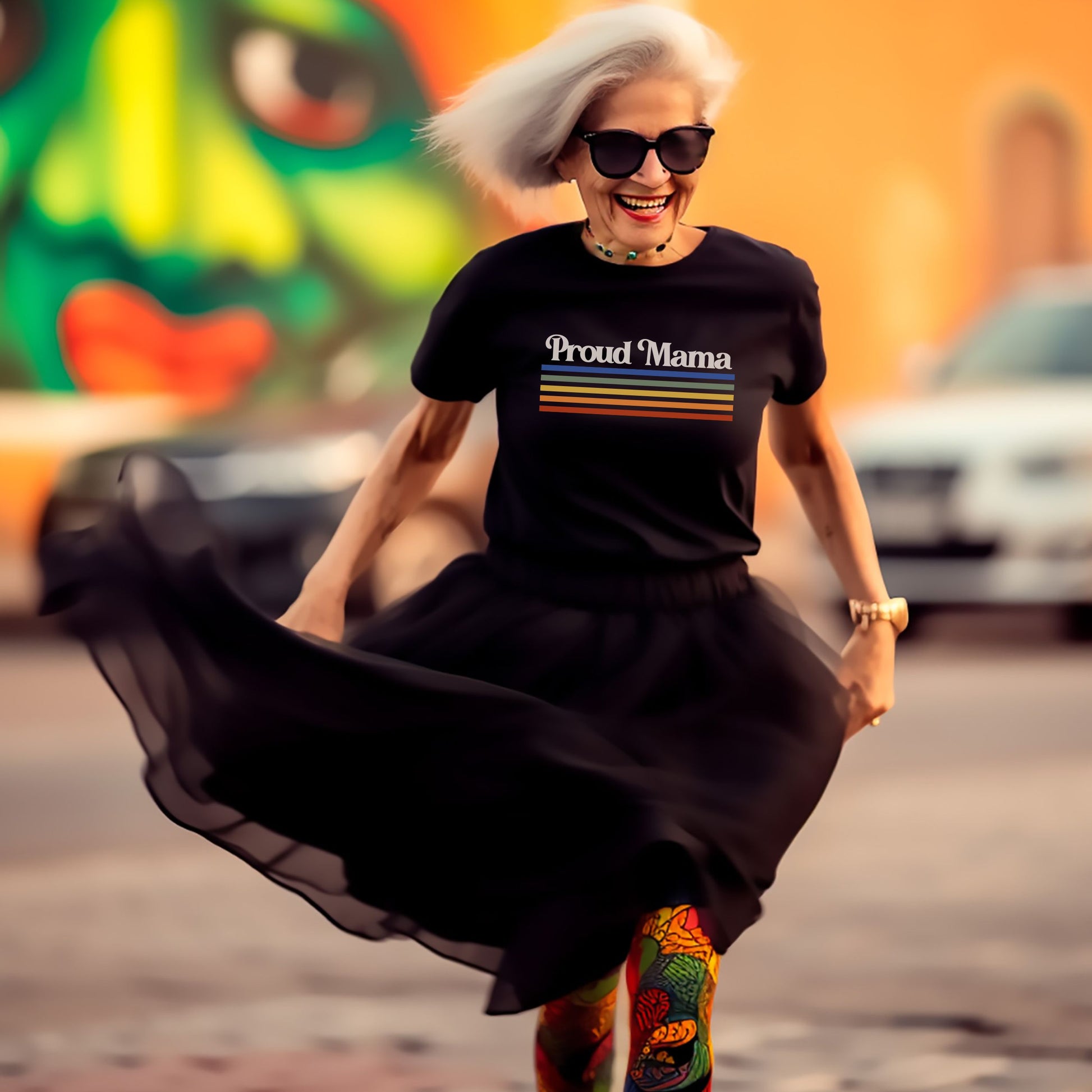 Mother dancing at Pride while wearing a black “Proud Mama” rainbow shirt. 